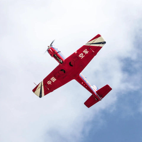 Underside view of CJ6 V2 1200mm RC Airplane For Adults 6 Channel PNP Foam Aerobatic Plane in red Nanchang CJ-6 livery with LED lights.