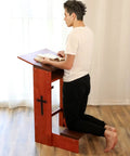 Person kneeling on Solid Wood Prayer Kneeler Bench With Folding Table Top For Home Or Church Padded Kneeler Shelf And Compact Design