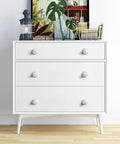 Ten Piece White Round Ceramic Drawer Knobs And Cabinet Pulls For A Quick Furniture Glow Up Featuring A Legit Glossy Grip And Super Chill Vibe To Make Your Cupboards Look Snazzy And Fresh on white dresser.
