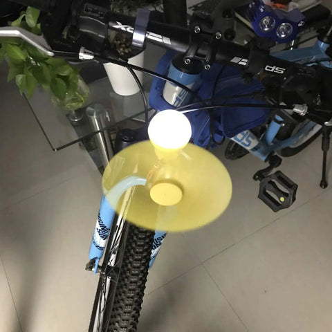 DIY Wind Turbine Kit For Teaching And Science Projects, Hands-On Tiny DC Motor Generator, Micro Wind Turbine With Fan Blades And LED Light, Power Generation Demo For Classrooms And Makerspaces mounted on a bike handlebar