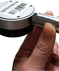 Heavy Lifter Manual Durometer Stand With Digital Shore Hardness Tester for precise rubber testing, held in hand.