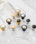 Round Cabinet Knobs 10 Pack Matte Black And Nickel displayed on a marble surface, showcasing solid metal construction and design variety.