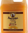 All In One Wood Polish And Conditioner With Carnauba Wax And Beeswax 64 oz bottle with label showing Feed-N-Wax branding.