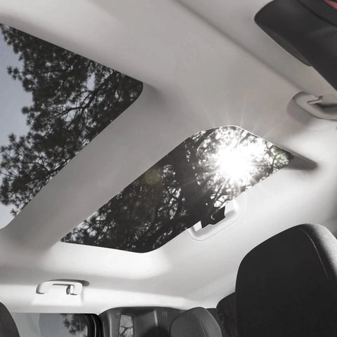 Installed Kefly gray mesh headliner fabric with foam backing in car roof; sunroof glass visible.