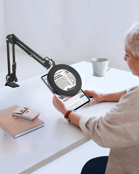Person reading with 5X And 10X Magnifying Lamp With Stand Clamp Lighted Magnifier For Close Work Crafting Sewing Model Making Jewelry.