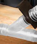 Clear 2-1/2 Inch Y Fitting for Dust Collection Hose connected to dual hoses in a woodworking setup.