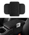 Center Console Armrest Cushion With Leather Look Upgraded Comfort Pad Featuring Two Storage Pockets Universal Waterproof Non Slip Car Interior Accessory For Most Sedans SUVs Trucks Black placed on vehicle console