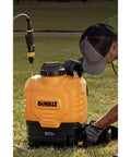 Man using 20V Max 4 Gallon Lithium Ion Cordless Backpack Sprayer Kit With 2Ah Battery, Heavy Duty Hose, Variflo Flow Control