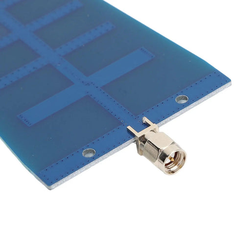 Close-up of Dual Band WiFi Yagi Antenna for FPV Drones, 2.4GHz 12dBi and 5.8GHz 3dBi, showing the SMA connector and PCB material.