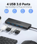 Four Port USB 3.0 Hub With 5Gbps Transfer, Laptop And PC Extender, Power Port Enabled displayed with peripherals connected