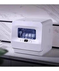 Compact Tabletop Dishwasher With Plug And Play Setup No Plumbing Needed Self Draining Front Opening Auto Dry And Storage Fits Large Plates visible in modern kitchen setting.