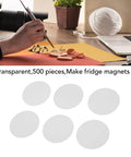 Crafting setup with 56mm Clear Round Badge Film Pack Scratch Proof Mylars Protective Sheets for DIY projects and fridge magnets.
