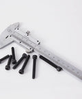 M5 Hex Socket Head Cap Screws Set With 20mm, 25mm, 30mm, 35mm, 40mm Lengths, 12.9 Grade Alloy Steel, Black Oxide Finish next to a caliper
