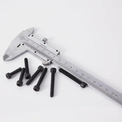 M5 Hex Socket Head Cap Screws Set With 20mm, 25mm, 30mm, 35mm, 40mm Lengths, 12.9 Grade Alloy Steel, Black Oxide Finish next to a caliper
