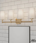 Nolita Vanity Light With Alturas Gold Finish And Cased White Glass against tiled wall, modern medium size bathroom fixture