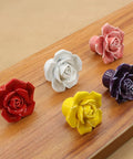Colorful ceramic rose knobs on wood, including 12 Pack Purple Rose Ceramic Knobs For Cabinets And Dressers Rose Flower Vintage Style Pulls