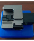 Heavy Duty Fiber Optic Cleaver CC-01 on blue base, designed for FTTH network cables and precise fusion splicing.