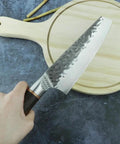 Beast Mode 7 Inch Meat Cleaver For Kitchen Prep, Chef Grade Forged Steel 5Cr15Mov Blade With Durable Sheath shown on cutting board