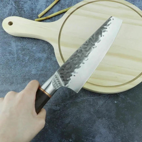 Beast Mode 7 Inch Meat Cleaver For Kitchen Prep, Chef Grade Forged Steel 5Cr15Mov Blade With Durable Sheath shown on cutting board