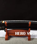 Handcrafted Practice Katana With Full Tang Blunt Blade For Dojo Training on wooden stand with white hamon detail