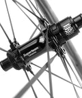 Close-up of the Superteam ceramic hub with spokes on the Carbon Disc Wheelset S All D28 50 Tubeless With Carbon Spokes 700C For Shimano Road Bikes.
