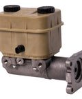 Brake master cylinder with tan plastic reservoir and hydraulic booster, mounted on gray metal housing.