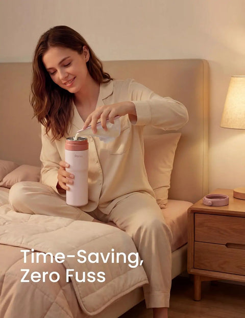 A woman in pajamas pouring water into a Portable Stainless Steel Breast Milk Chiller, ideal for storing milk.