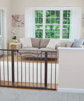 Living room scene with tall and wide baby gate for doorways with easy install no drilling and pressure mount decor friendly design.