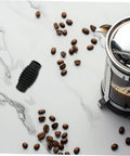 Espresso Steam Wand Heat Insulation Sleeve Anti Burn Rubber Wrap For Coffee Machines next to coffee beans and French press