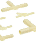 Assorted yellow plastic hose tees and Y adapters for automotive use; multiple pieces visible.