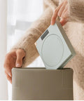 Ultra Smooth Electric Coffee Mug Warmer Usb Powered Cup Heater With Five Level Temp Control Auto Shut Off Compact Base being placed in a bag.