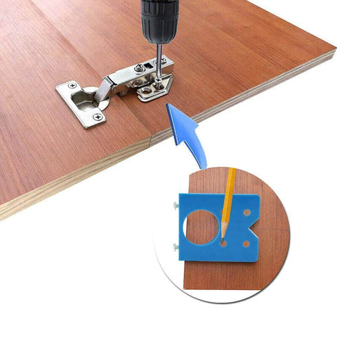 Blue 35mm concealed hinge drilling jig mounted on a wooden door with metal mounting plate and drill guide