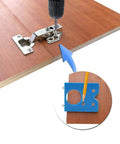 Baxnore concealed hinge jig drill guide, blue metal cabinet hinge drilling tool shown on a wooden door