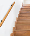Rock Solid Pine Wood Stair Handrail With Legit Heavy Duty Metal Brackets And Smooth Rounded Corners For Reliable Indoor Wall Mount Support Carrying Groceries Or Packages No Sweat, mounted on wall next to wooden stairs.