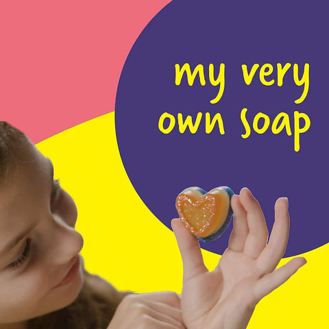 Child holding heart-shaped soap from Soap Making Kit For Kids Create 8 Colorful Soaps With Fragrance And Glitter Using Four Molds A Kid Approved Hands On Science Craft For Boys And Girls Aged 6 To 12 A Fun Educational Gift