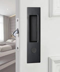 6.3 Inch Privacy Pocket Door Lock Hardware For Double Barn Doors Keyless Mortise Lock Sliding Door System In Black Durable Zinc Alloy Handle Brass Cylinder Silent Operation Anti Rust Finish installed on a white door.