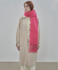 Woman wearing Cozy Large Blanket Wrap Shawl For Women, Soft Thick Knit Scarf Neck Warmer in pink, standing indoors.