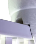Close-up of railing planter installed on a balcony railing, showing drainage holes and durable polyethylene construction in white.