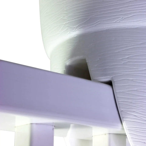 Close-up of railing planter installed on a balcony railing, showing drainage holes and durable polyethylene construction in white.