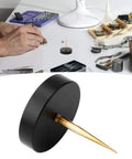 Pro Grade Watch Balance Holder for precise balance correction on a watchmaker's workbench with tools and components.