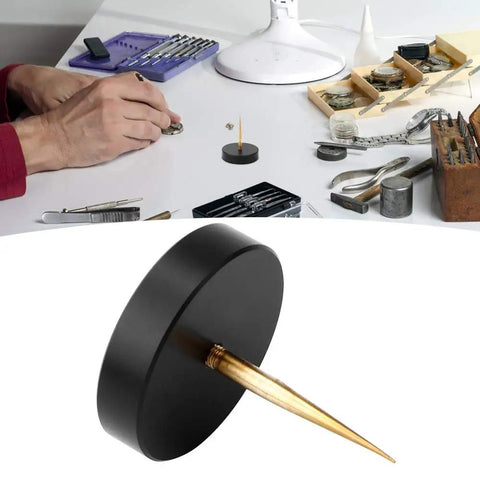 Pro Grade Watch Balance Holder for precise balance correction on a watchmaker's workbench with tools and components.