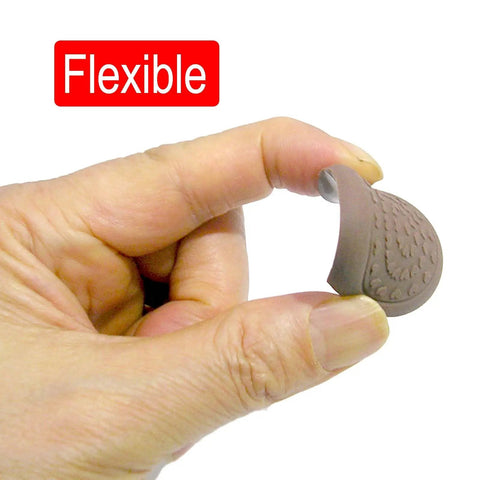 Person holding flexible Anti Slip Cutting Board Stabilizer Pad with Self Adhesive Rubber Feet.