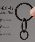 Ultralight Titanium Flat Key Rings Set With Side Pushing Split Rings In 33mm 25mm And 17.5mm Sizes being held, made from Ti-6Al-4V