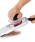 Handheld Mandoline Slicer For Kitchen With Adjustable Slices In 1mm 2.5mm 4mm, Secure Non Slip Handle And Stable Base For Quick Potato And Veggie Prep, EZ Even Cuts For Busy Home Cooks slicing a potato