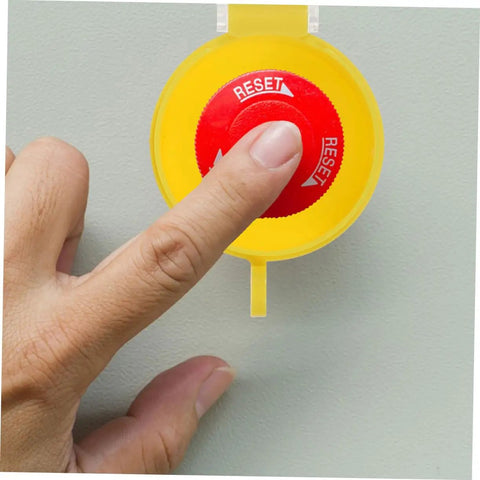 Finger pressing reset button with 2 Pack Transparent Switch Safety Guard Covers For Laundry Machines Emergency Start Button Protectors with Clear View