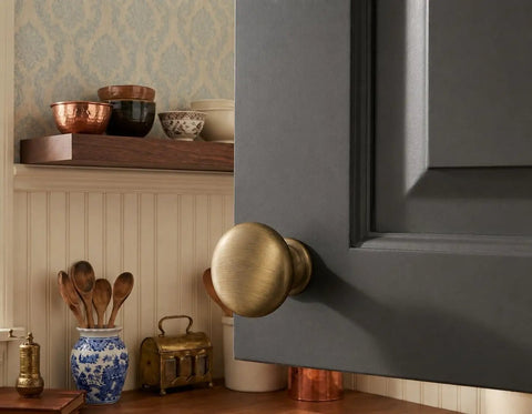 Brushed Antique Brass Cabinet Knob Set 10 Pack One And A Quarter Inch Round Mushroom Style Hardware For Cabinets And Drawers Includes One Inch Mounting Screws Built To Last Metal Drawer Pulls on gray cabinet door