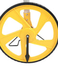 Tough Foldable Digital Measuring Wheel With Telescopic Shaft And Sweet Backlit Readout Includes Compact Tape Measure close-up of yellow measuring wheel.
