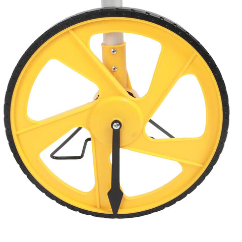 Top Tier Digital Measuring Wheel With Slick Backlit Display And Hella Smooth Rolling Action Featuring Boss Telescopic Handle close-up of yellow wheel for tracking distances.