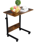 Rock Solid Height Adjustable Computer Desk With Smooth Rollin Casters For Easy Repositioning And Firm Lockdown Heavy Duty Steel Top Crafted As A Compact Standing Laptop Station, featuring a wooden top with fruits and decor.