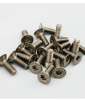 Premium Grade 2 Titanium Countersunk Screw Set Crisp Torx Drive Metric Fasteners For Garage Builds And Bike Mods Rock Solid Dark Grey Finish 12 Piece Pack shown in close-up, highlighting texture and design.